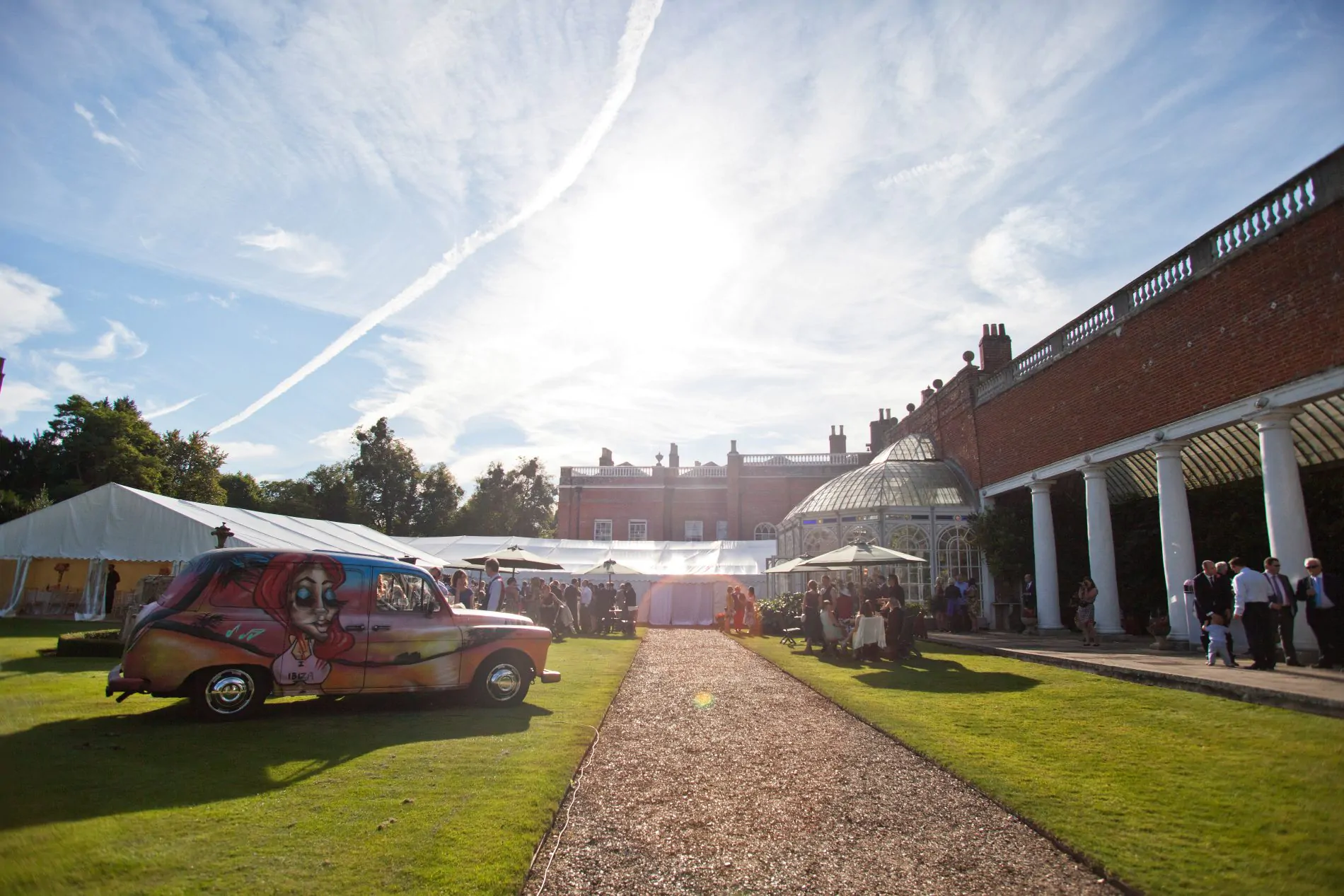 Bespoke car and corproate event marquee outside a grand Georgian building on a sunny day.